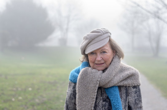 Stylish elderly woman on a cold winter day