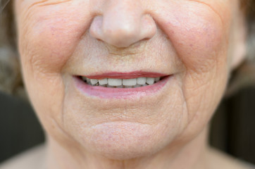 Closeup on the mouth of a senior woman