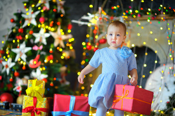 Fototapeta na wymiar little girl with Christmas gifts