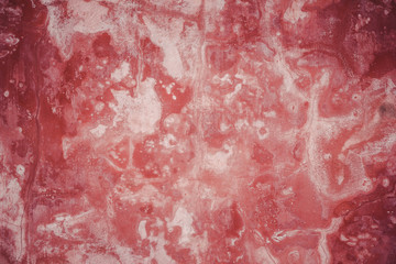 Grunge weathered red paint concrete wall background.
