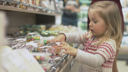 Family makes purchases in the supermarket