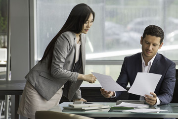 Business associates reviewing documents