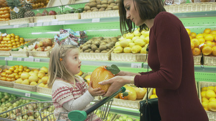 Family makes purchases in the supermarket