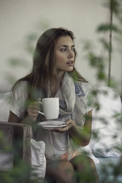 Woman enjoying hot drink outdoors
