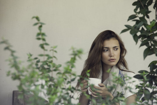 Woman enjoying hot drink outdoors