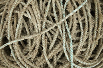 A full page of tangled old fishing rope background texture