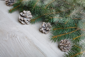 Christmas background with xmas tree and sparkle bokeh lights on wooden canvas background. Merry christmas card. Winter holiday theme. Happy New Year. Space for text. Happy Holidays