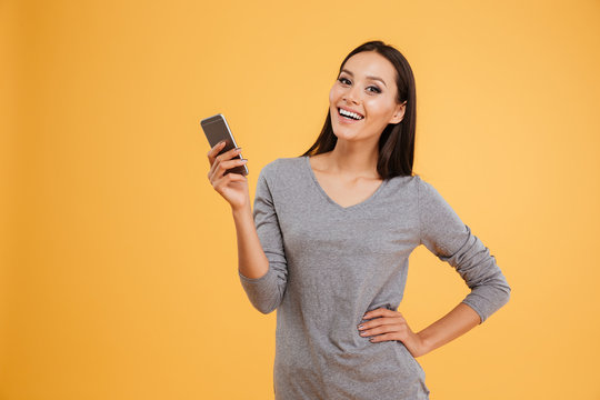 Portrait of smiling model with phone