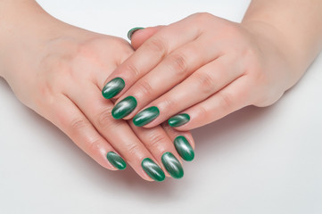 Manicure on long nails oval green cat's eye