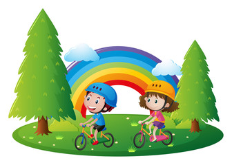 Fototapeta na wymiar Boy and girl riding bicycle in park