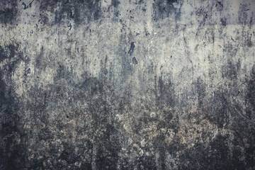 Grunge dirty stained concrete wall with peeling paint background.