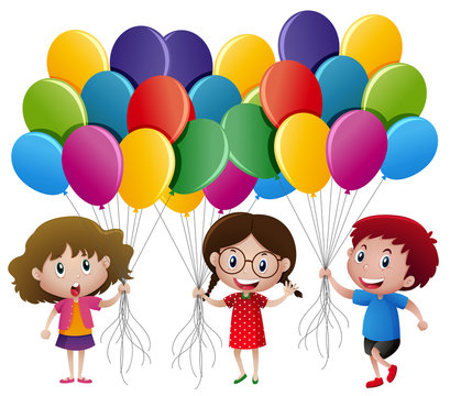 Three kids holding balloons