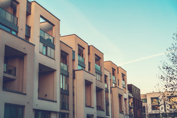 modern townhouses with orange and warm facade at autumn afternoon at prenzlauer berg, berlin