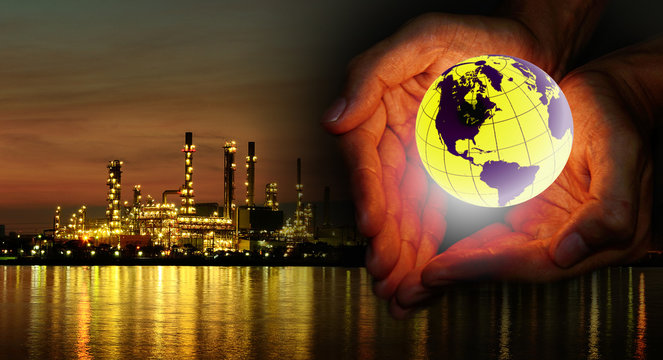 Save power concept, World in hand with Oil refinery background