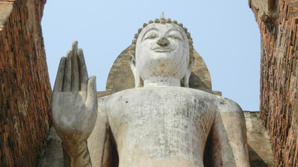 Fototapeta na wymiar Standing Buddha image, Wat Mahathat, Sukhothai Historical Park, Thailand