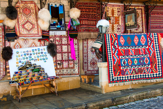Baku, Azerbaijan. Beautiful decorated carpets at street market