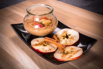 Fresh oatmeal porridge with apples and cinnamon for healthy breakfast