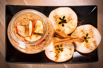 Fresh oatmeal porridge with apples and cinnamon for healthy breakfast