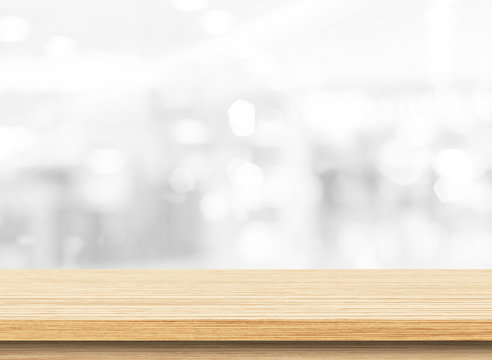 Wood table top on white blurred abstract background. Used for display or montage your products