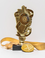 First place, cup and medal, isolated