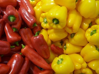 background of many fresh red and yellow peppers