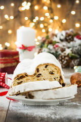 Christmas stollen. Traditional German Christmas dessert on wooden background
