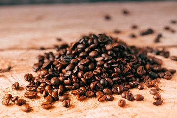 Fototapeta na wymiar Closeup of coffee beans with focus on one
