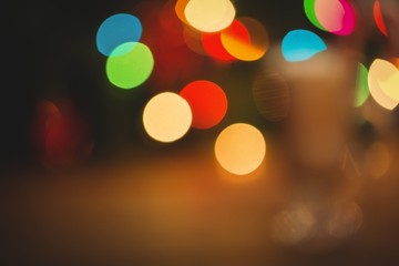 Defocused of christmas tree lights and fireplace
