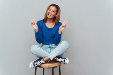 African woman sitting on chair