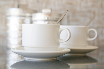 Obraz na płótnie Canvas Two coffee cups on the table