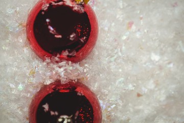 Close-up of christmas baubles on snow