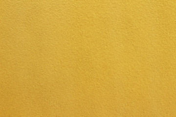 yellow stucco wall useful for backgrounds or textures
