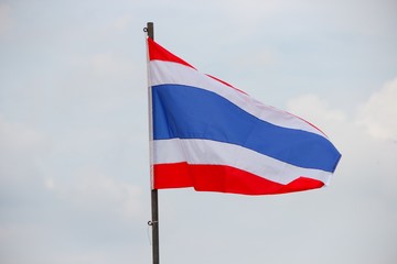 Thai flag, waving in the wind with beautiful with blue sky backg