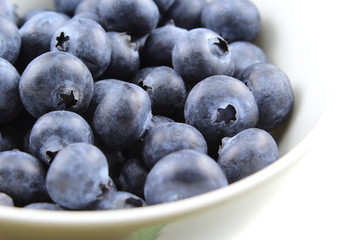 blueberry fruits in a small white bowl