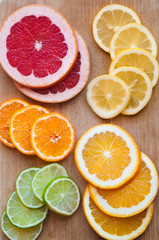 Slices of various citrus fruits (orange, grapeftuit, lemon, mandarine, lime)