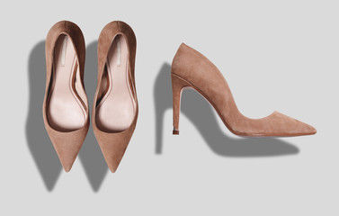 Beige suede women's shoes with high heels shot from top and from the side isolated on white
