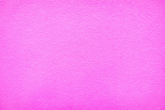 Textured background. Pink painted wall.