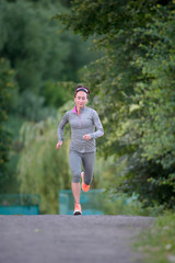 Running athlete woman. Female runner sprinting during outdoors t