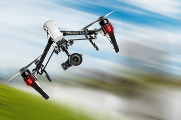 Fototapeta na wymiar White drone quad copter with high resolution digital camera flying.