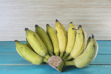 fresh bananas on wooden background