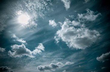 Obraz premium bright blue sky with clouds and sun 