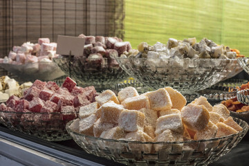 Sweets covered with coconut flakes at Christmas bazaar