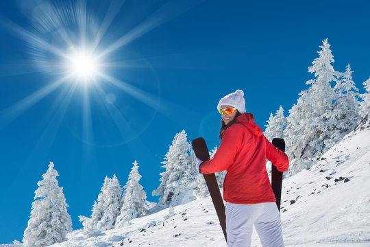 Beautiful young woman with ski.