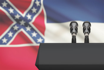 Pulpit and two microphones with USA state flag on background - Mississippi