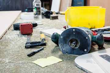 Various tools and supplies at carpentry workshop.