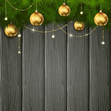 Golden Christmas decorations on black wooden background