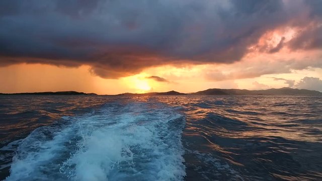 slow motion video of suset shot on moving boat in the caribbean