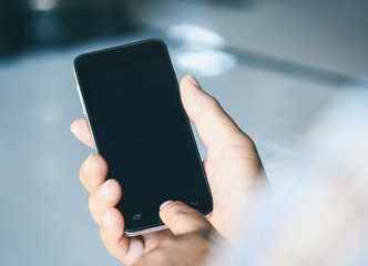  Man using smartphone in a car.