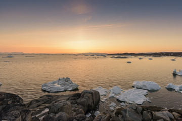Iceberg on arctic ocean against sky