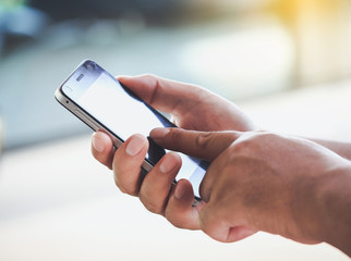 Man hands using a smartphone.